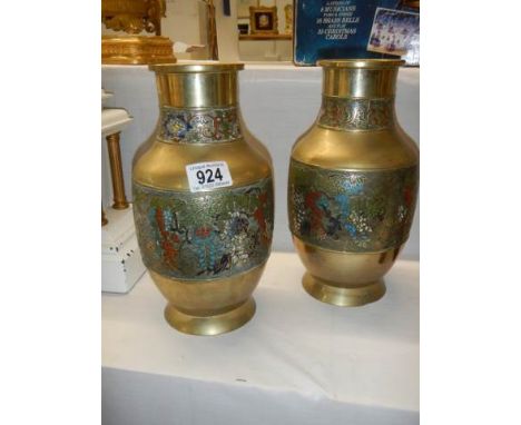 An early pair of brass and enamel vases.