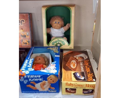 A boxed Ideal cabbage patch kid, Telitoy dolls carricot and Pedigree first love doll