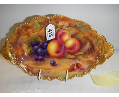 A Royal Worcester hand painted footed fruit bowl signed M H Price, in excellent condition.No visible crazing or wear to gildi