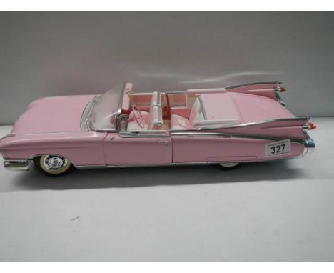 A 1/12 scale pink Cadillac car.Good condition but dusty.No box or certificate. Length 47cm