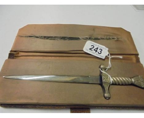 A cased letter opener in the form of a dagger with eagle feature.