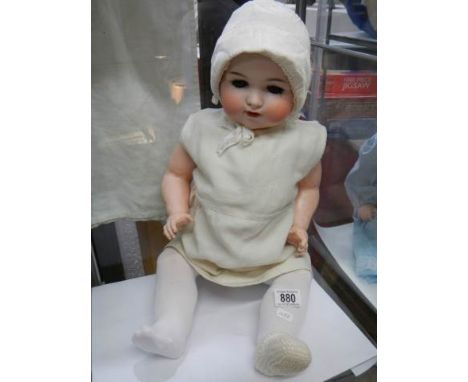 An Armand Marseille bisque headed doll, Model 990, a 13 M.