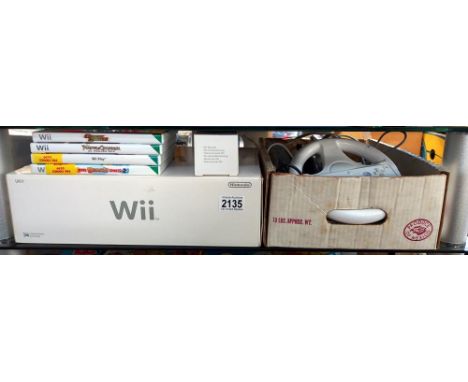 A boxed Wii console, accessories and games