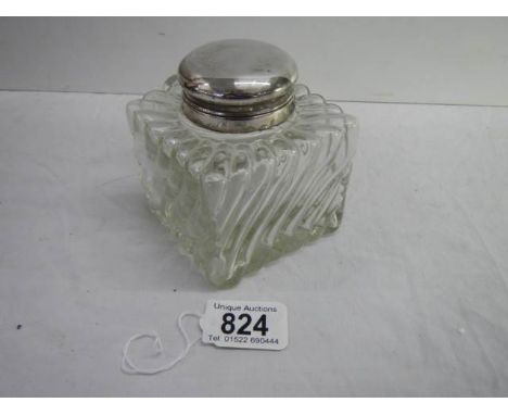 A 3.5" square 19th century silver topped glass inkwell with handle.