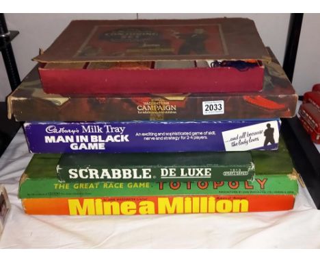 A quantity of games including Scrabble (letters still wrapped in original packaging), Totopoly, Campaign and a magic conjurin