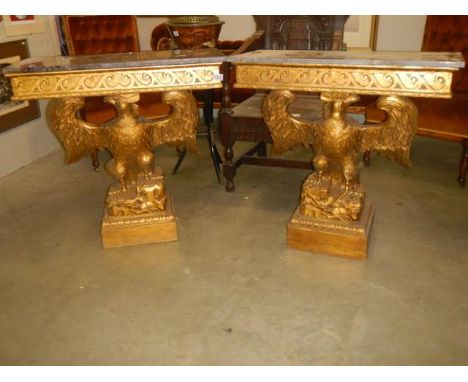 A pair of marble top console tables supported by eagles. COLLECT ONLYTop 83cm x 37cm x 82cm high.Slight chipping to marble on