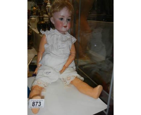 An Armand Marseille bisque headed doll, model No. 390, A.4.M. 53 cm / 21 ", jpinted body, in good condition.