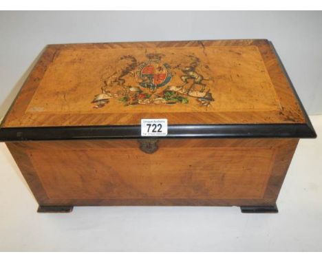 A Victorian B H Abrahams music box with 3 butterfly bells playing 10 tunes, with Royal Coat of Arms transfer on lid, in worki