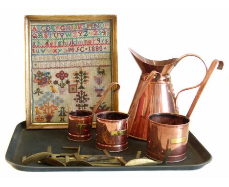 Needlework sampler, set of copper measures, a jug and a collection of brass table leaf joiners. Condition reports are not ava