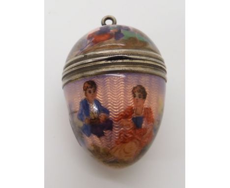 A GUILLOCHE ENAMEL EGG SHAPED VINAIGRETTE PENDANT made in white metal with continental marks, the opalescent pale pink enamel
