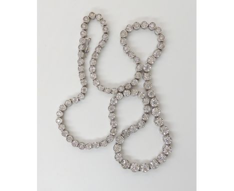 AN 18K WHITE GOLD DIAMOND RIVERA NECKLACE with a combined estimated diamond content of estimated approx 3.91cts, each diamond