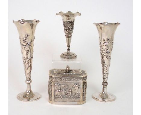 A PAIR OF CHINESE SILVER SPILL VASES decorated with prunus, beneath a wavy rim, stamped marks, 164 grams, 18cm high, an India