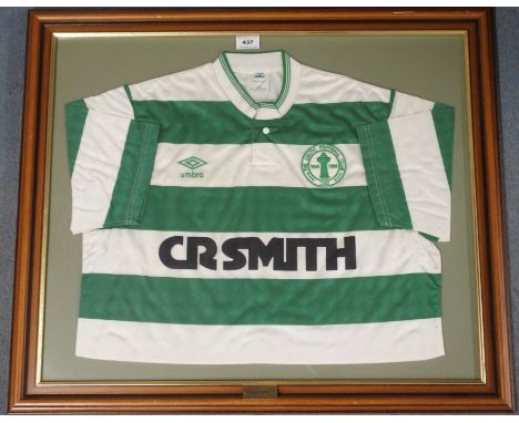 A GREEN AND WHITE CELTIC SHORT-SLEEVED SHIRT with button-up collar and embroidered badge, inscribed The Celtic Football Club,