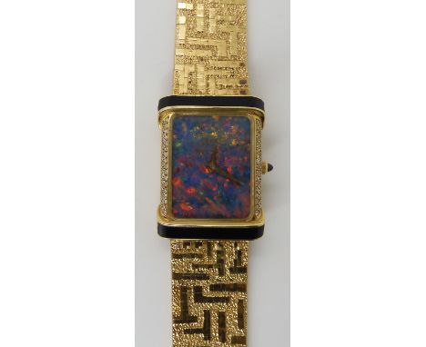 AN 18CT GOLD OPAL, DIAMOND AND ONYX LADIES PIAGET WRISTWATCH the fiery opal dial, has a gold coloured Piaget logo, with gold 