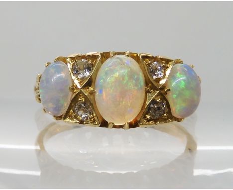 AN 18CT GOLD OPAL AND DIAMOND RING hallmarked Birmingham 1905, largest opal approx 7mm x 5mm x 2.3mm, finger size N, weight 4