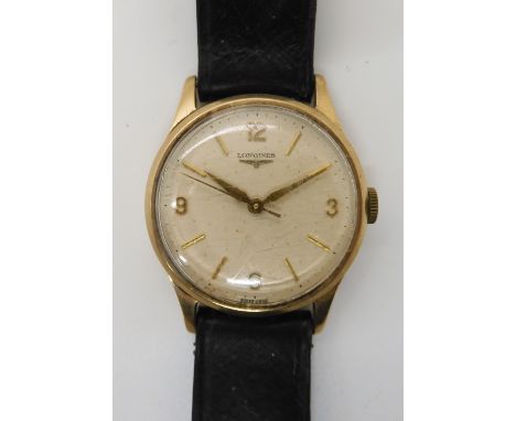 A 9CT GOLD GENTS LONGINES WATCH with cream dial gold coloured Arabic and baton numerals. Birmingham hallmarks for 1959-60. Di