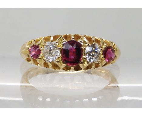 AN 18CT GOLD SYNTHETIC RUBY AND DIAMOND RINGin scalloped mount, combined diamond weight estimated approx 0.25cts, largest rub