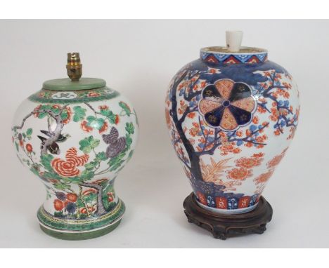 A CHINESE FAMILLE VERTE VASE LAMP painted with birds in branches, 31cm high and an Imari jar painted with flowering trees and