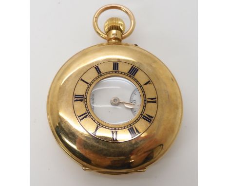 A 9CT J.W.BENSON HALF HUNTER POCKET WATCH with a enamelled chapter ring to the case, a white enamel dial, black Roman numeral