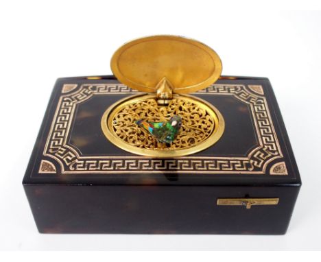 A 19TH CENTURY TORTOISESHELL AND ENAMEL BIRD AUTOMATON MUSIC BOX of rectangular form, with a clockwork mechanism operated by 