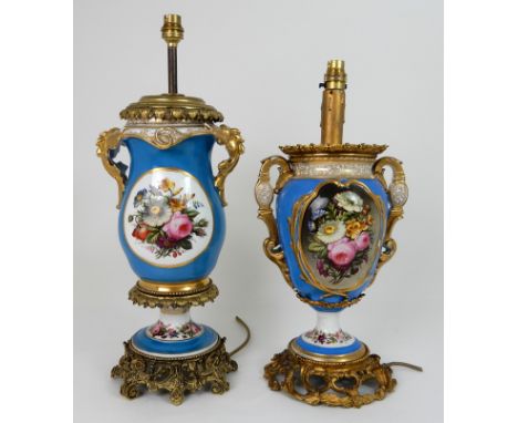 A SEVRES STYLE TABLE LAMP of two handled urn form, painted with flowers within gilt cartouches, with ormolu mounts and base, 