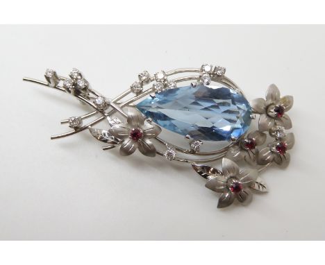 AN 18CT WHITE GOLD AQUAMARINE, DIAMOND AND RUBY BROOCH by Cropp & Farr Ltd, the dimensions of the pearshaped aquamarine are 2