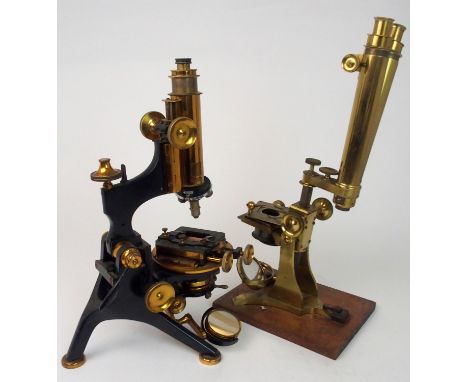 A VICTORIAN BRASS MICROSCOPE stamped James How &amp; Co, 5 Bride St, Late, 2 Foster Lane, City, London, 40cm high and another