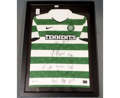 A GREEN AND WHITE CELTIC SHORT-SLEEVED SHIRT the front bearing numerous player autographs from the 2010-11 squad, with certif