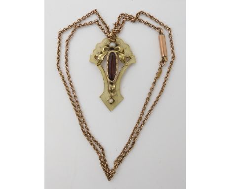 A YELLOW METAL BELLE EPOCH ENAMELLED PENDANT set with purple glass gem and pearls, length 3.5cm, with a vintage 9ct chain len