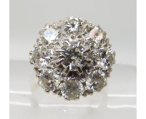 AN 18CT GOLD DIAMOND CLUSTER RING set with estimated 3cts of brilliant cut diamonds in total, in classic flower formation, wi