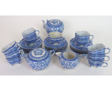 A JAPANESE BLUE AND WHITE TEA SERVICE finely painted all over with Ho-o birds and scrolling foliage, comprising;tea pot, 12cm