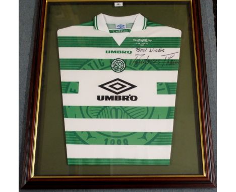 A GREEN AND WHITE CELTIC COCO-COLA LEAGUE CUP FINAL CELTIC SHIRT, 1997 the front autographed by Andreas Thom, framed and glaz