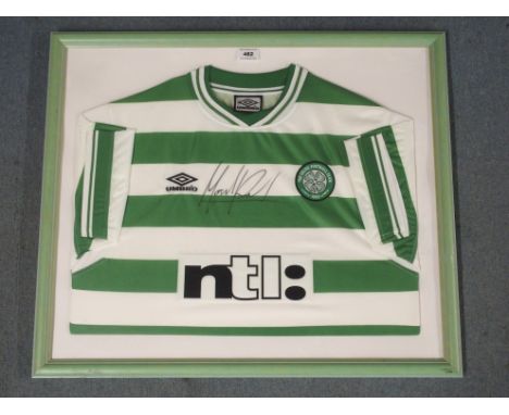 A GREEN AND WHITE CELTIC SHORT-SLEEVED SHIRT the front autographed by Mark Viduka, framed and glazed, 60 x 71cm overall All p