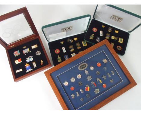 TWO CASED SET OF THE OLYMPIC PROGRAMME ATLANTA 1996 ENAMEL LAPEL BADGES a framed set of Sydney 2000 Olympic lapel badges and 