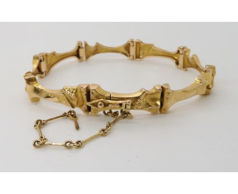 A 14K GOLD LAPPONIA BRACELET of abstract form, length 18cm, weight 17.8gms Condition Report: Safety chain broken otherwise li