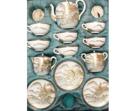 A SATSUMA CASED TEA SET painted with female figures before rivers in a mountainous landscape, comprising;teapot, sugar bowl, 