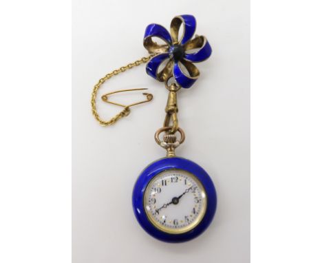 A SILVER GILT ENAMELLED FOB WATCH with white enamelled dial, gold dot markers with black Arabic numerals and blued steel hand