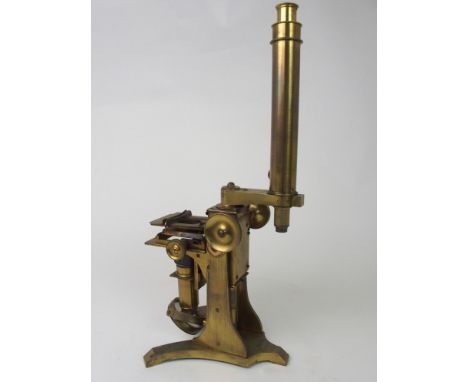 A VICTORIAN BRASS MICROSCOPE BY A. ROSS, LONDON the foot stamped A Ross, London, No.467, with various lenses and accessories,