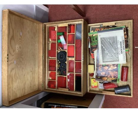 A quantity of mainly post war Meccano components. Presented within a scratch built wooden box (three wooden trays within), co