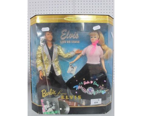 A 1996 Mattel Collectors Edition 'Barbie Loves Elvis' Doll Gift Set, complete with outfits, accessories, props, doll stands a