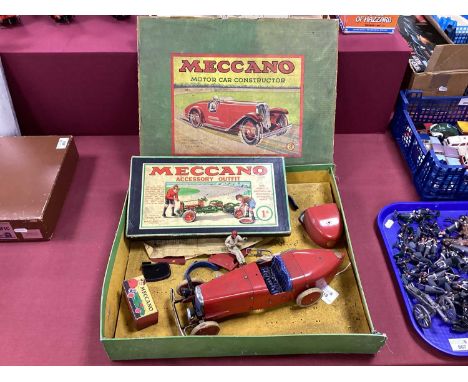 A 1930s Meccano No 2 Constructor Car, in red, part built with many spares, including windscreen, driver,spare back. spare whe