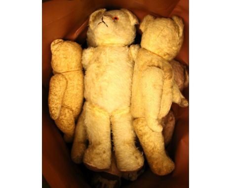 A collection of teddy bears, mid to late 20th century, to include a large bear wit button eyes, four biscuit coloured example