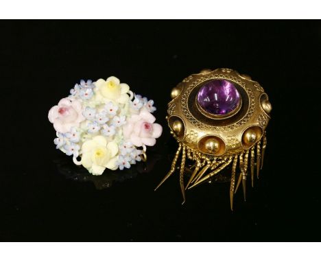 A Victorian gold foiled back quartz shield brooch, a central foiled back amethyst, rub set to a rope border and a circular fr