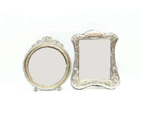 An early 20th century silver framed circular easel mirror,Birmingham 1910, maker HM, the circular bevelled plate within a scr