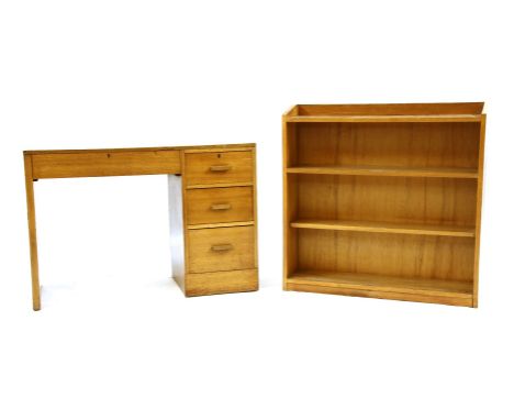 An Art Deco oak desk, the rectangular top with drawer above kneehole section and bank of three drawers, 108cm wide, 46cm deep