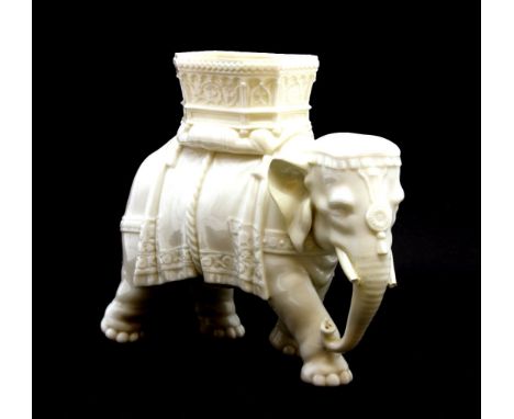 A late 19th century Royal Worcester model of an elephant, modelled by James Hadley, in blanc de chine finish, impressed tusks