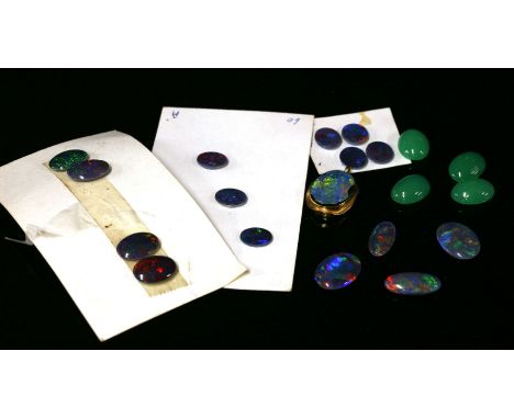 A gold single stone black opal doublet pendant, the black opal doublet rub set to a polished pendant mount, (tested as approx