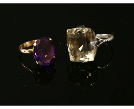 A gold single stone synthetic colour change sapphire ring, claw set to a plain polished shank, (replacement shank), size M½, 