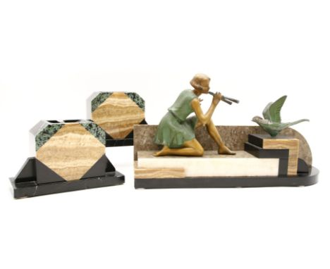 Art Deco garniture, each with veined marble bases, the central piece with cold painted spelter figure