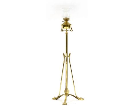An early 20th century brass standard lamp, in the Art Nouveau taste, with good glass shade, total height 154cm